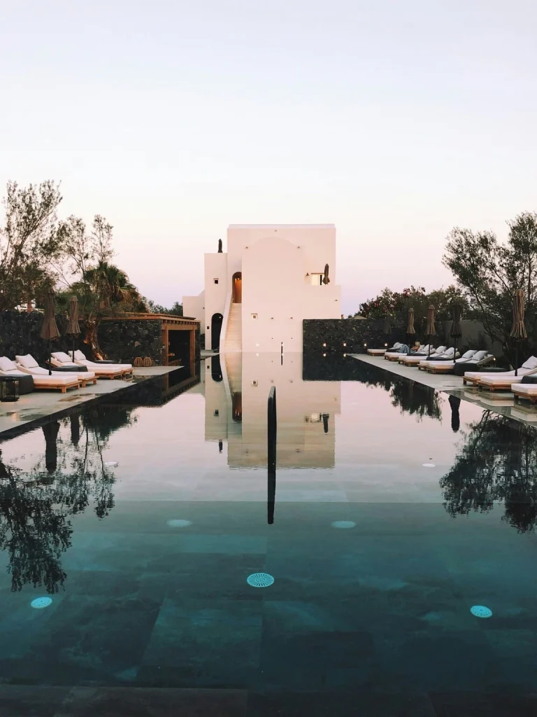 hotel with pool and lounge chair