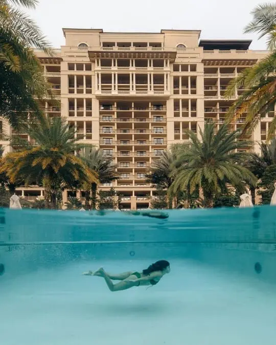 girl under water in pool