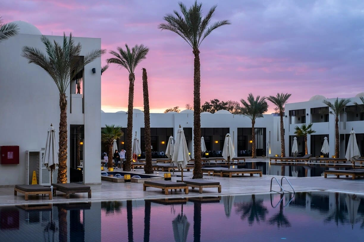 hotel pool with sunset